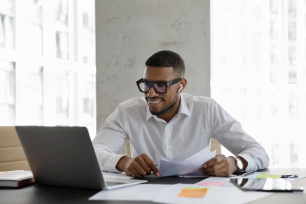 istock Happy young Afro American business professional man in glasses 1369578663