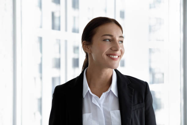 istock Happy business professional posing at office window glass 1369578714
