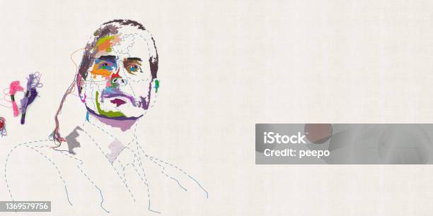 Embroidered Multicoloured Portrait Of Male Head With Sewing And Skeins Of Thread Stock Photo - Download Image Now