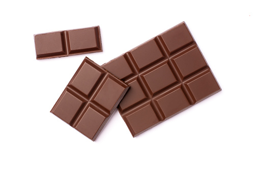 Milk chocolate bar isolated on white background. Top view.