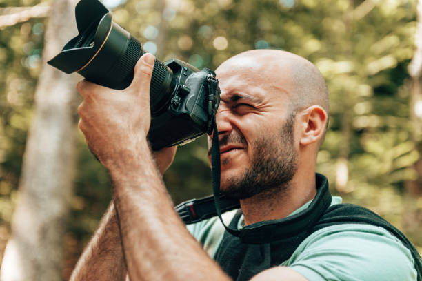 istock photographer in the forest 1369580789