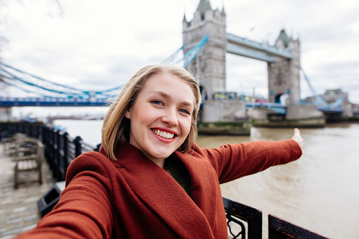 Young Woman Taking Selfie at Tower Bridge in London