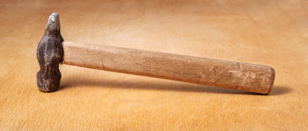 istock The hammer is on a wooden board. 1369580994
