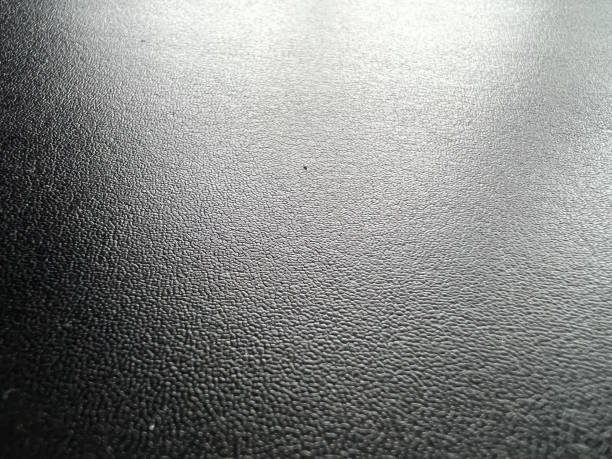 istock Very fine black leather as texture or background. 1369581553