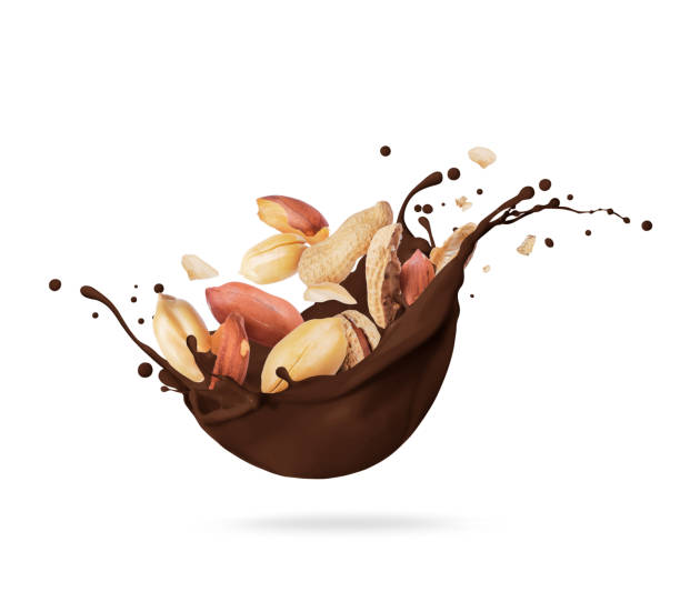 istock Dried crushed peanut in chocolate splashes isolated on white background 1369582139