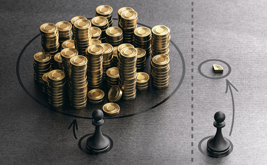 Two pawns and symbolic golden coins over black background. Concept of economic or income inequality and economic gap between rich and poor. 3D illustration.
