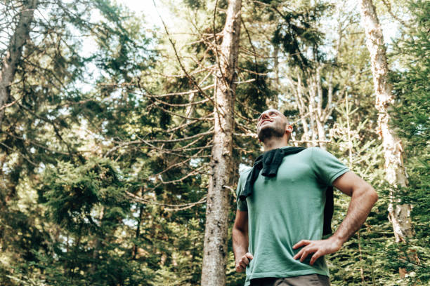 istock hapiness bald man smiling the forest 1369582530