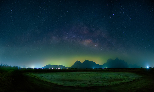 Landscape with Milky way galaxy. Night sky with stars over mountain. Long exposure photograph.