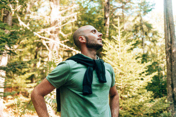 istock hapiness bald man smiling the forest 1369582771