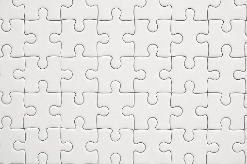 White jigsaw puzzle pattern background.