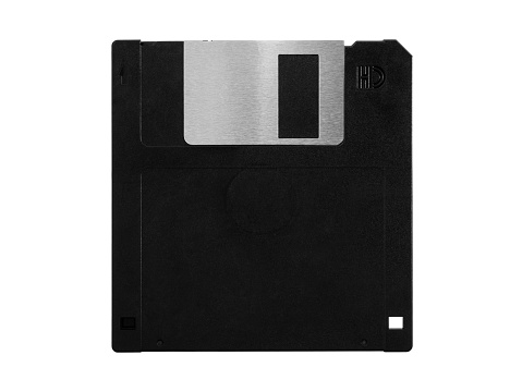 Old computer floppy disk, black diskette, no label, isolated on white background
