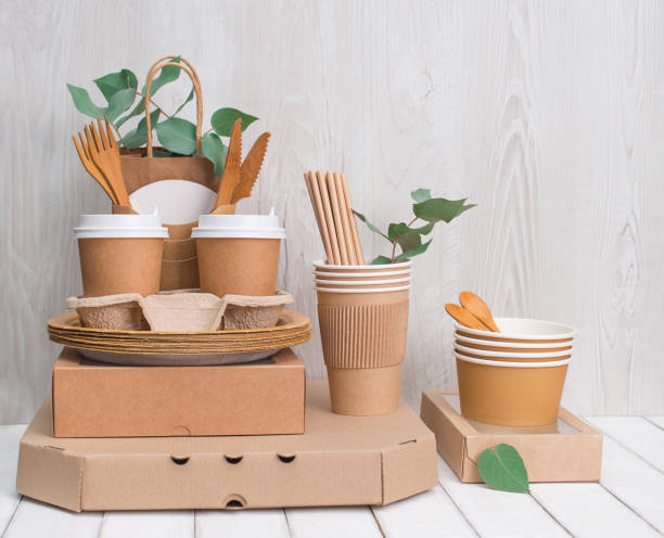 istock Eco friendly different food boxes and containers from paper and eucalyptus leaves on white wooden background with copy space. Plastic free. Zero waste. 1369583998