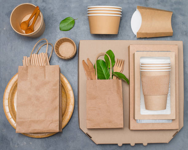 istock Eco friendly different food boxes and containers from paper on grey background. Plastic free. Zero waste. 1369584036