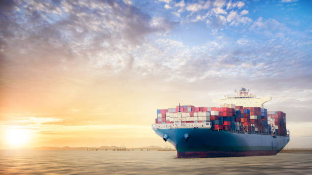 istock Container cargo ship in the ocean at sunset sky, Global business logistics import export background, Freight transportation, Shipping 1369585279