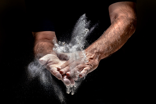 Male hands with flour
