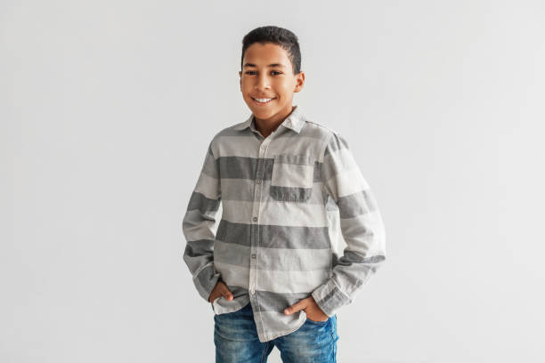 istock Cheerful African American Boy Standing Smiling To Camera, Gray Background 1369589028