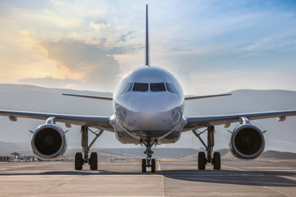 istock Front view of landed airplane on runway 1369589990