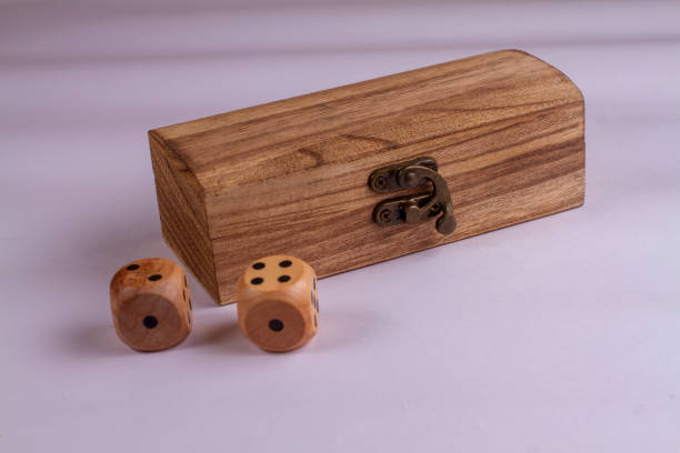 istock Two wooden box and dice isolated against a white background 1369590177
