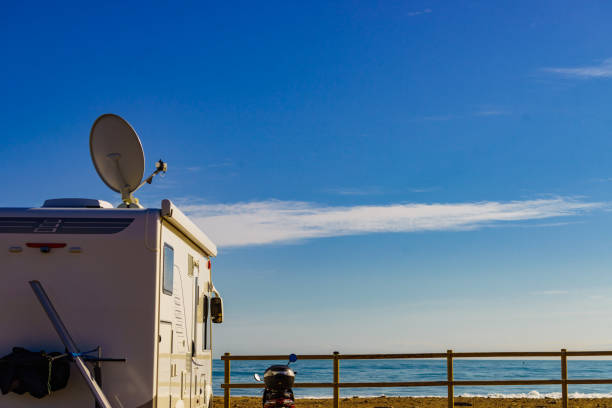 istock Satellite dish on roof of caravan 1369590238