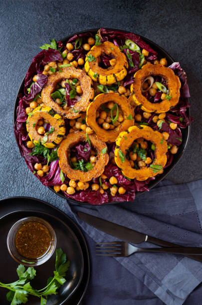 istock Healthy salad with delicata squash, radicchio and chickpeas 1369590622