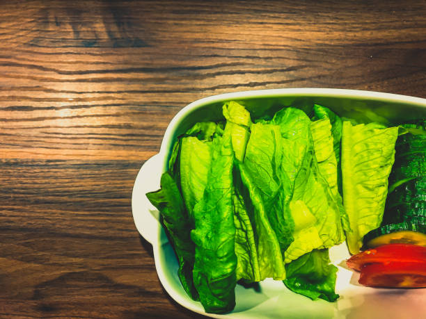 Sliced fresh salad with cucumbers and tomatoes in a bowl.