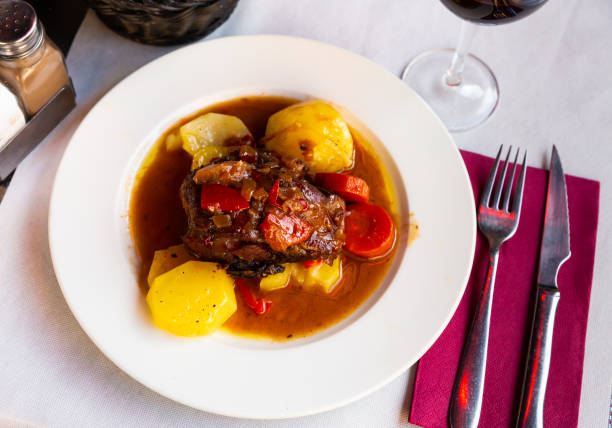 istock Baked lamb shoulder with vegetables 1369594839