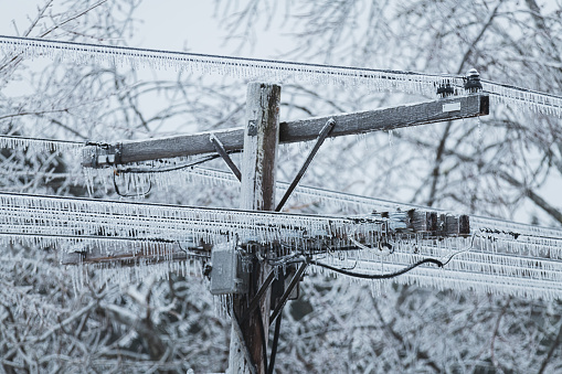 Power lines weighed down by ice during an intense ice storm.