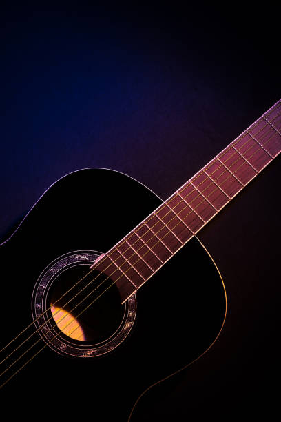 istock black guitar front view vertical. guitar music low-key concept 1369600509