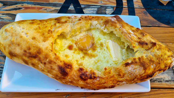 istock Georgian dish Adjarian Khachapuri with egg on a plate 1369601667
