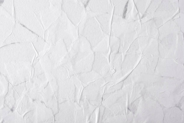 istock Abstract background of white crumpled paper. 1369603258
