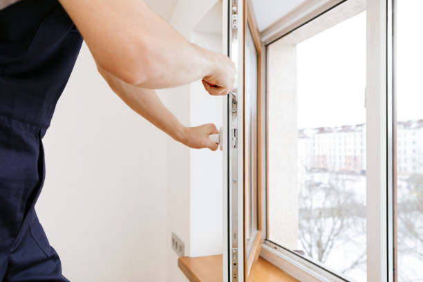 istock The worker installing and checking window in the house 1369603312