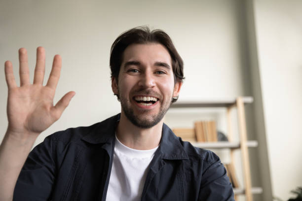 istock Happy handsome young man holding video call conversation. 1369604125