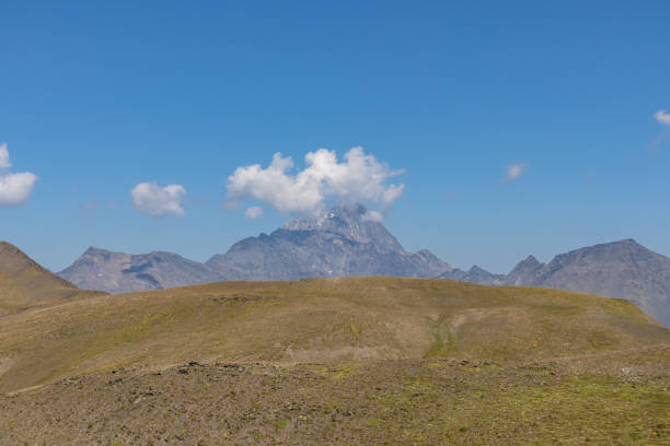 istock Roshka - A panoramic view on the sharp mountain peak f in the Greater Caucasus Mountain Range in Georgia. 1369604153