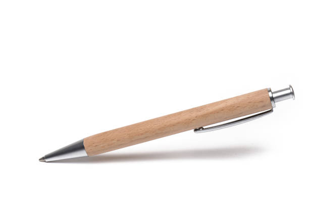 Closeup business pen covered wood white background