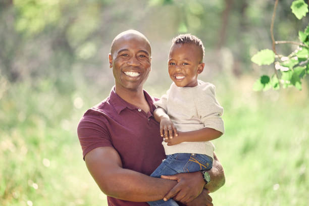 istock Shot of a man spending the day outdoors with his son 1369607647