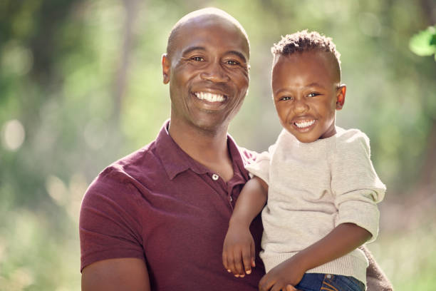 istock Shot of a man spending the day outdoors with his son 1369607652