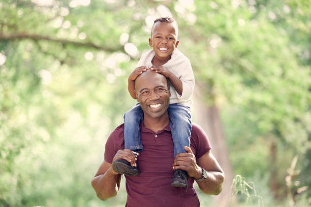 istock Shot of a man spending the day outdoors with his son 1369607664