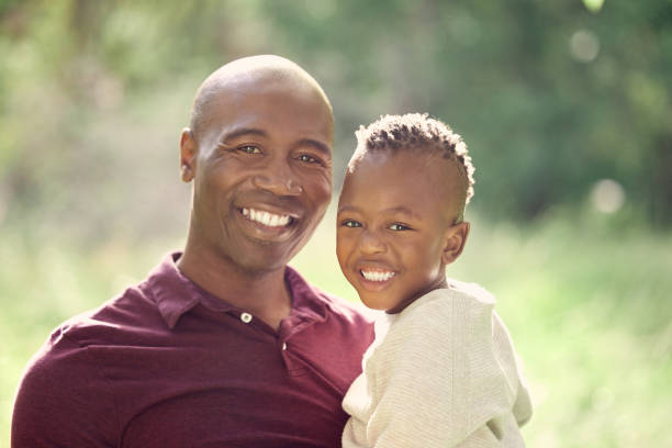 istock Shot of a man spending the day outdoors with his son 1369607671