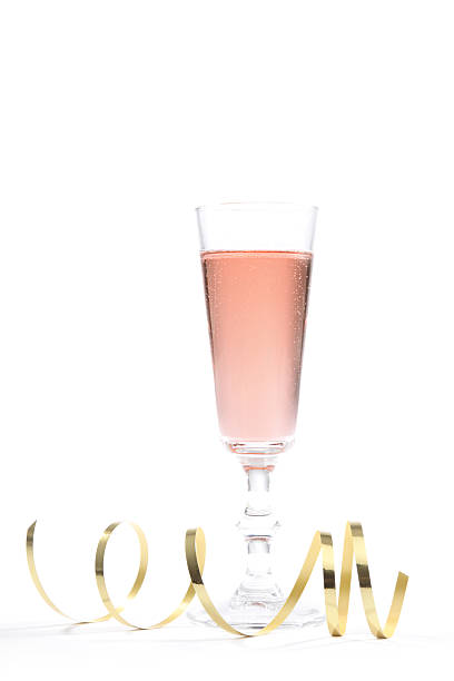 Party Pink Champagne Pink champagne with gold ribbon for a celebration rose champagne stock pictures, royalty-free photos & images