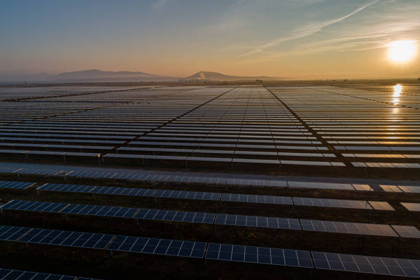 istock sunrise on solar panel field aerial view in Mexico 1369608580