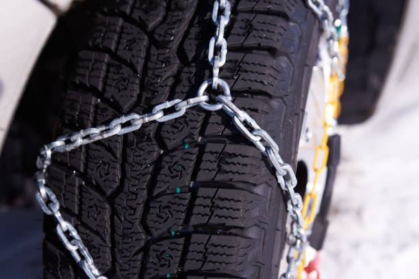 istock snow chain on a wheel in deep snow in winter 1369610226