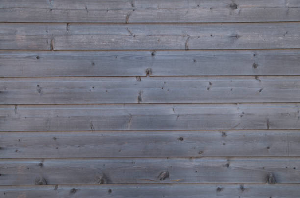 istock Old gray wooden wall close 1369610246