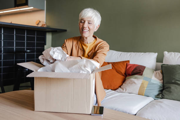 istock Package delivery and unpacking of ordered items at home 1369611107