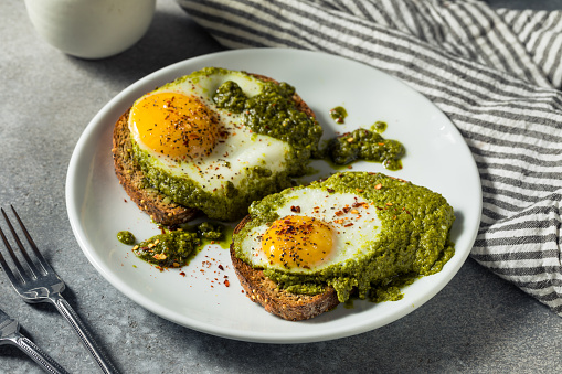 Healthy Organic Pesto Egg Toast for Breakfast with Pepper