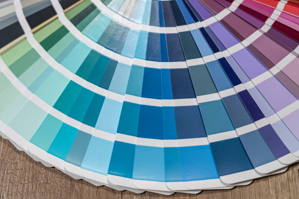 istock Color stack of test samples for paint or fabric in rainbow spectrum colors on the table. 1369612178