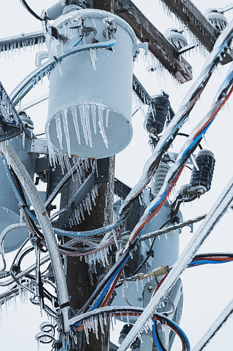 Power lines weighed down by ice during an intense ice storm.