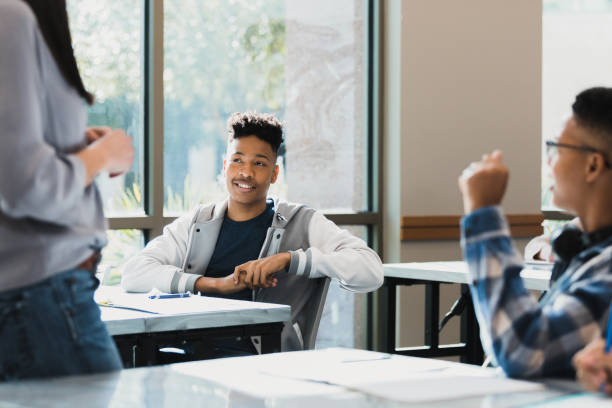 istock Teen students interact with unrecognizable female teacher 1369617354