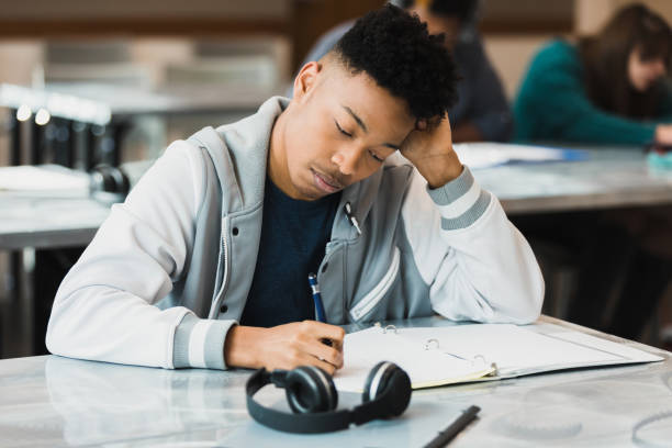 istock Teen students take exam in class 1369617378