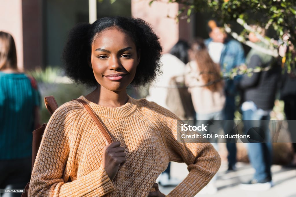 Confident Teen Girl With Cool Attitude Poses For Photo Stock Photo -  Download Image Now - iStock