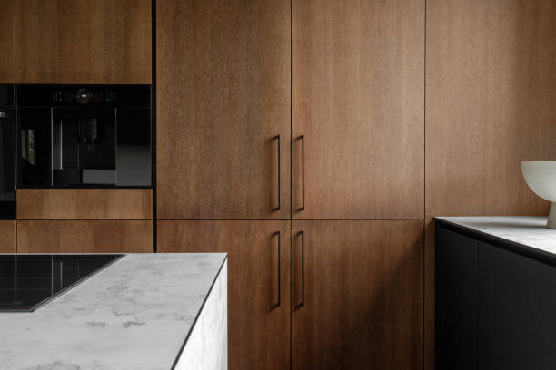 istock Modern minimalistic kitchen with black and wooden surfaces, marble kitchen island top and household appliances. Modern Concept For Interior Design And Architecture. 1369620200